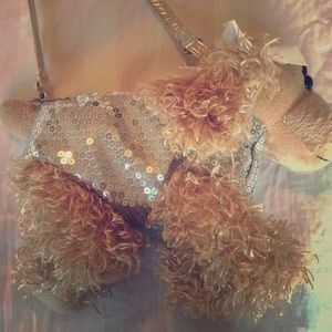 I am selling a light brown poodle purse.